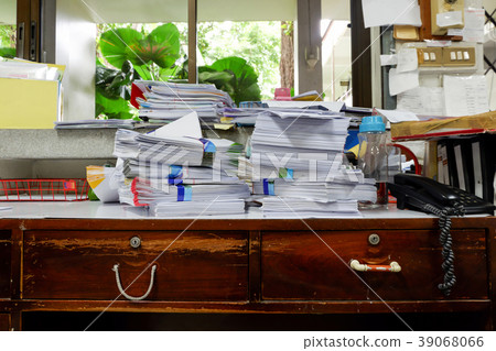 Busy, messy and cluttered workplace 39068066