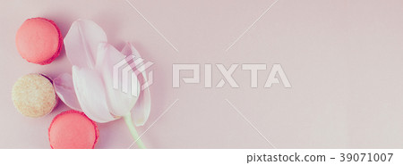 Flat lay of macaroons and Pink tulip with petals Flat lay of macaroons and Pink tulip with petals 39071007