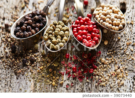 Peppers on wooden background Peppers on wooden background 39073440