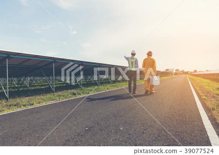 engineer and technician checking efficiency  39077524