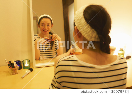 Taking care of beauty evening tea while drinking herbal tea Taking care of beauty evening tea while drinking herbal tea 39079784