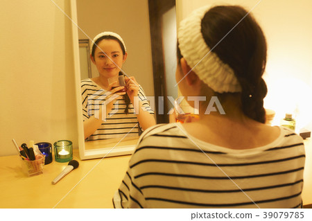 Taking care of beauty evening tea while drinking herbal tea Taking care of beauty evening tea while drinking herbal tea 39079785