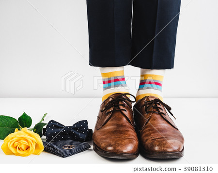 Wedding rings, rose and funny socks 39081310