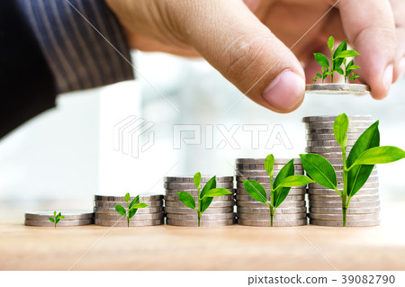 Businessman Hand Put Coins To Stack Of Coins  39082790