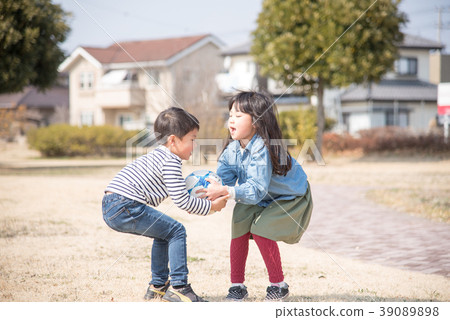 Kids playing soccer ball 39089898