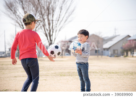 Boy practicing soccer Boy practicing soccer 39089900