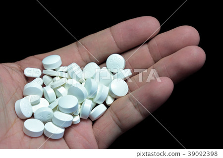 Pills of medicine in a hand. Pills of medicine in a hand. 39092398