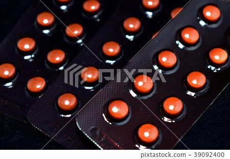 Packs of medicine on black background. 39092400