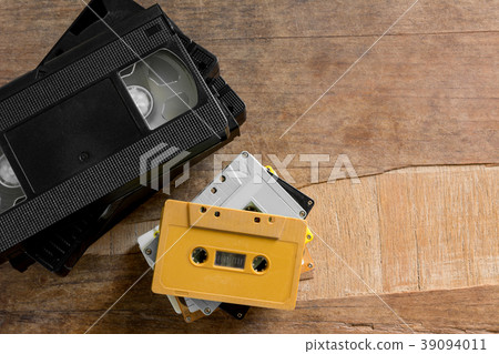 old cassette and video tape on wooden board. old cassette and video tape on wooden board. 39094011