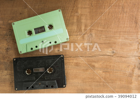 cassette tape on crack and dirty wooden board. cassette tape on crack and dirty wooden board. 39094012