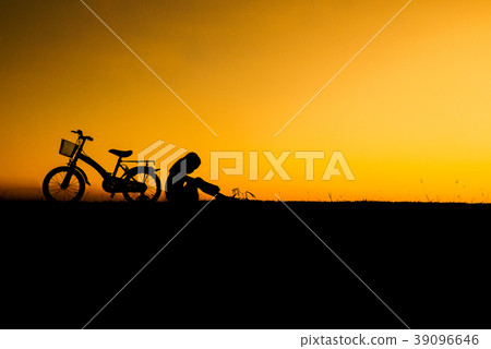 Little cute dreaming girl sitting in silhouette 39096646