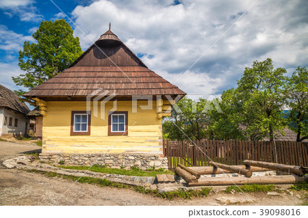 An ancient colorful house in the Vlkolinec village An ancient colorful house in the Vlkolinec village 39098016