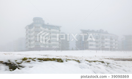Residential low-rise houses in dense fog Residential low-rise houses in dense fog 39098869