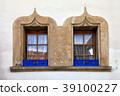 stone decorated windows on old house, Switzerland 39100227