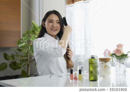 Beauty young woman combing hair Beauty young woman combing hair 39101908