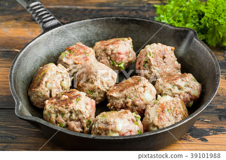 Fried meatballs on black cast-iron pan Fried meatballs on black cast-iron pan 39101988