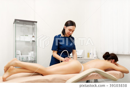 Beautiful woman getting vacuum therapy in beauty Beautiful woman getting vacuum therapy in beauty 39103838