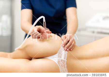 Sexy woman getting vacuum therapy, correcting and 39103845