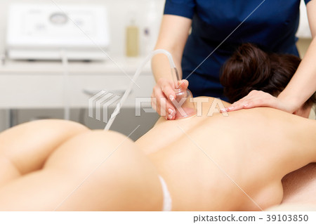 Sexy woman getting vacuum therapy procedure on her 39103850