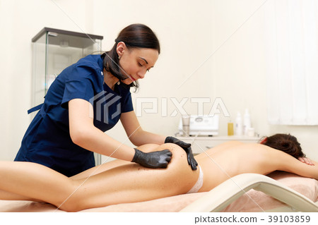 Attractive woman having scrub anticellulite Attractive woman having scrub anticellulite 39103859