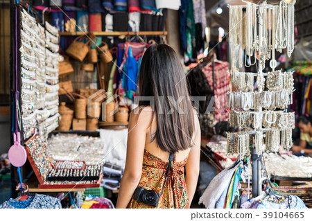 Young woman traveler at ubud market in bali Young woman traveler at ubud market in bali 39104665