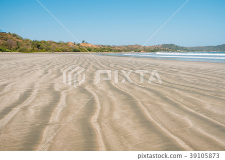 beach sand closeup , blurred landscape background beach sand closeup , blurred landscape background 39105873