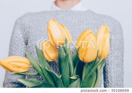 Cropped image of a bouquet of yellow tulips Cropped image of a bouquet of yellow tulips 39106699