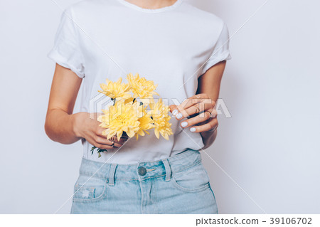 Slender woman in a T-shirt and jeans Slender woman in a T-shirt and jeans 39106702