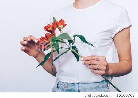 Slender woman in a T-shirt and jeans Slender woman in a T-shirt and jeans 39106703