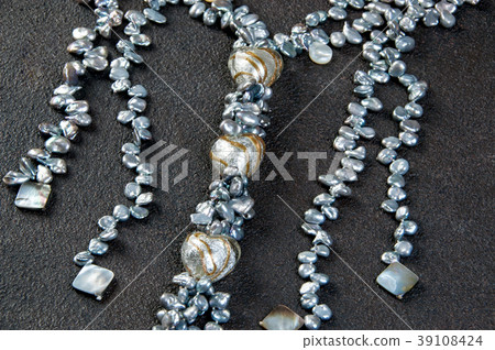 Vintage pearl necklace on black background Vintage pearl necklace on black background 39108424