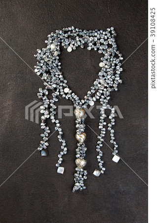 Vintage pearl necklace on black background Vintage pearl necklace on black background 39108425