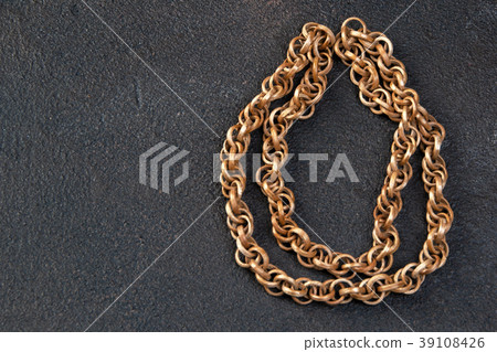 Vintage wooden necklace on black background 39108426