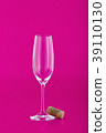 Wine glass with cork on pink 39110130