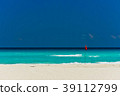 Cancun beach and red flag 39112799