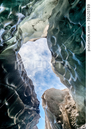 Ice cave, large hole beneath glacier, in Iceland Ice cave, large hole beneath glacier, in Iceland 39120789