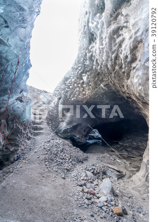 Ice cave, large hole beneath glacier, in Iceland Ice cave, large hole beneath glacier, in Iceland 39120792