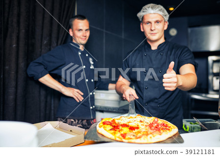Waiters carrying plates with food, in restaurant. Waiters carrying plates with food, in restaurant. 39121181