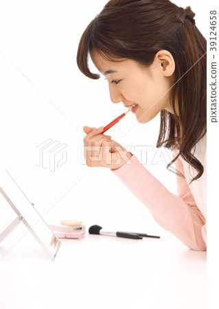 A girl painting lipstick A girl painting lipstick 39124658