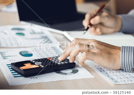 Businessman accountant pressing calculator Businessman accountant pressing calculator 39125140