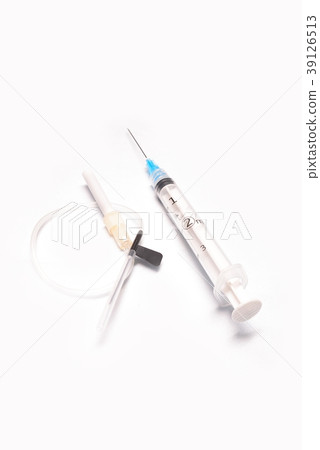 Medical syringe closeup with catheter on white bac 39126513
