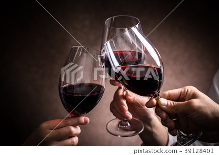 A toast with red wine A toast with red wine 39128401