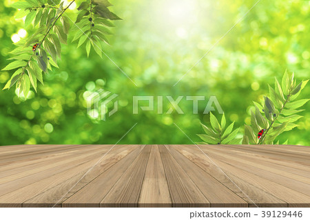 Brown Wooden table with green blurred background. Brown Wooden table with green blurred background. 39129446