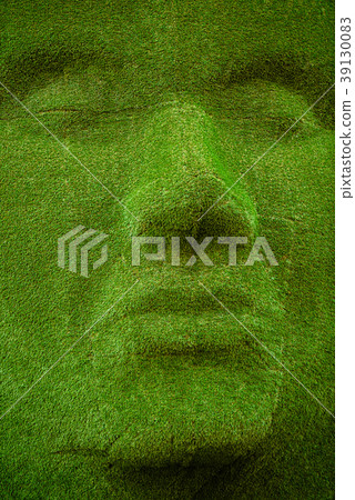 The whole statue is covered in moss and tiny leaves The whole statue is covered in moss and tiny leaves 39130083