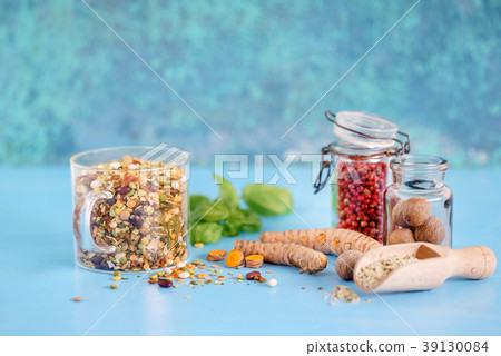 different spices on the blue background different spices on the blue background 39130084