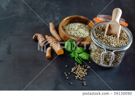 hemp seeds on the black background hemp seeds on the black background 39130090