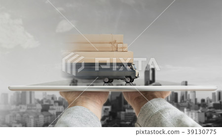 Hand holding digital tablet with delivery truck Hand holding digital tablet with delivery truck 39130775