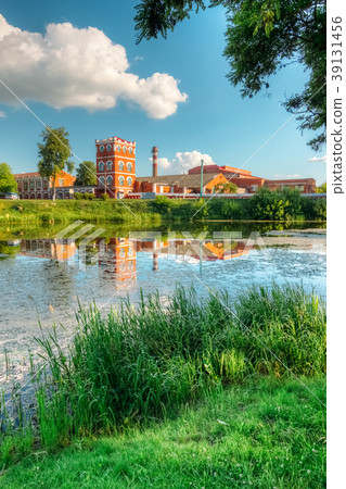 Summer river with a paper factory on the shore Summer river with a paper factory on the shore 39131456
