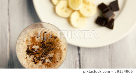 Banana chocolate smoothie with a dash of cinnamon. Banana chocolate smoothie with a dash of cinnamon. 39134906