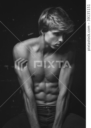 Young Handsome man portrait at dark background Young Handsome man portrait at dark background 39135151