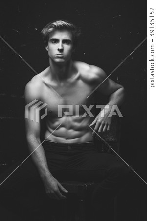 Young Handsome man portrait at dark background Young Handsome man portrait at dark background 39135152